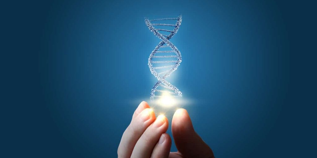 DNA in hand on blue background.